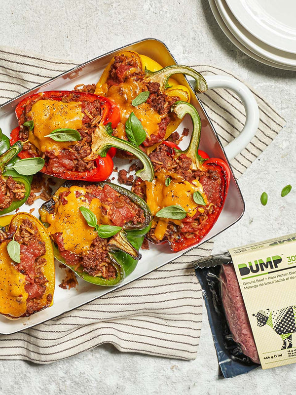 Six Cross-Cut Bell Peppers Stuffed with Bump Beef and Cheese on a Enamel Sheet Pan